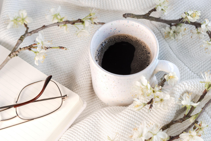 Morning journal with coffee in warm light